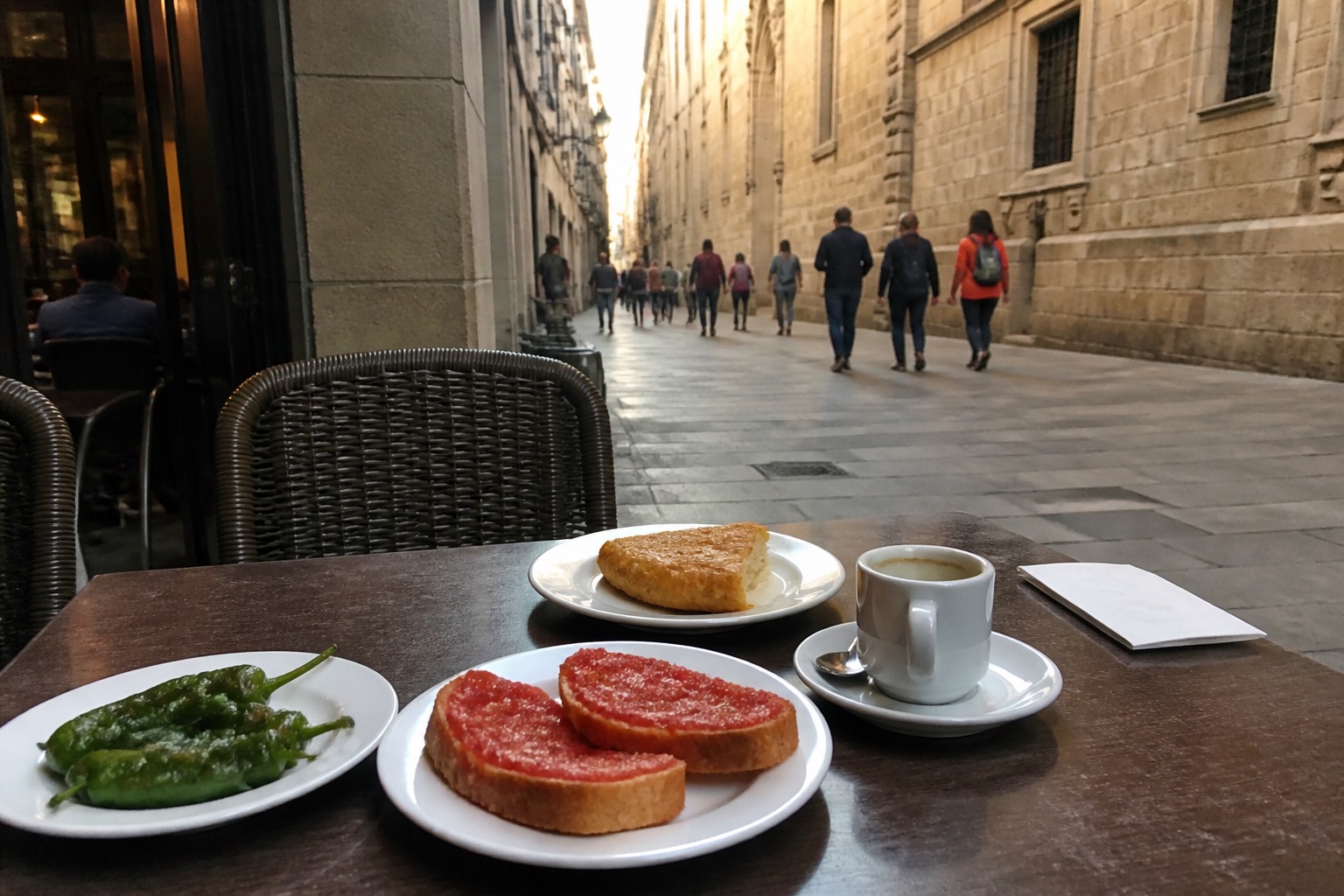 Phone snapshot: tapas and coffee on a Gothic Quarter café table