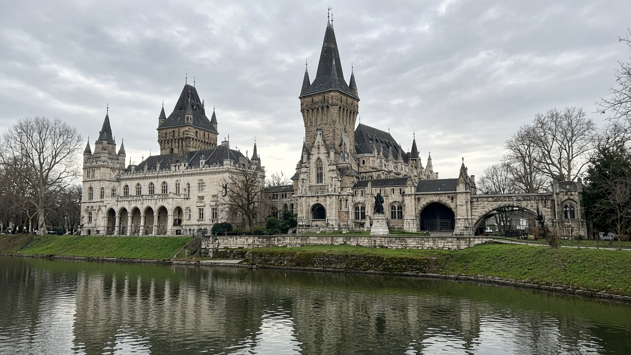 Tourist phone photo of Vajdahunyad Castle towers reflected in the City Park canal, Budapest