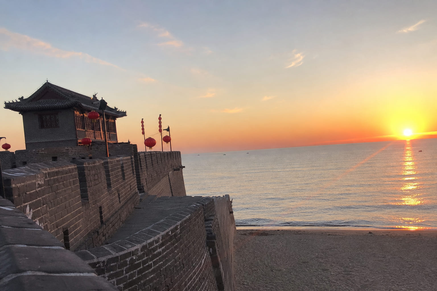 Sunset at Shanhaiguan — Great Wall section meeting the Yellow Sea, casual smartphone travel photo