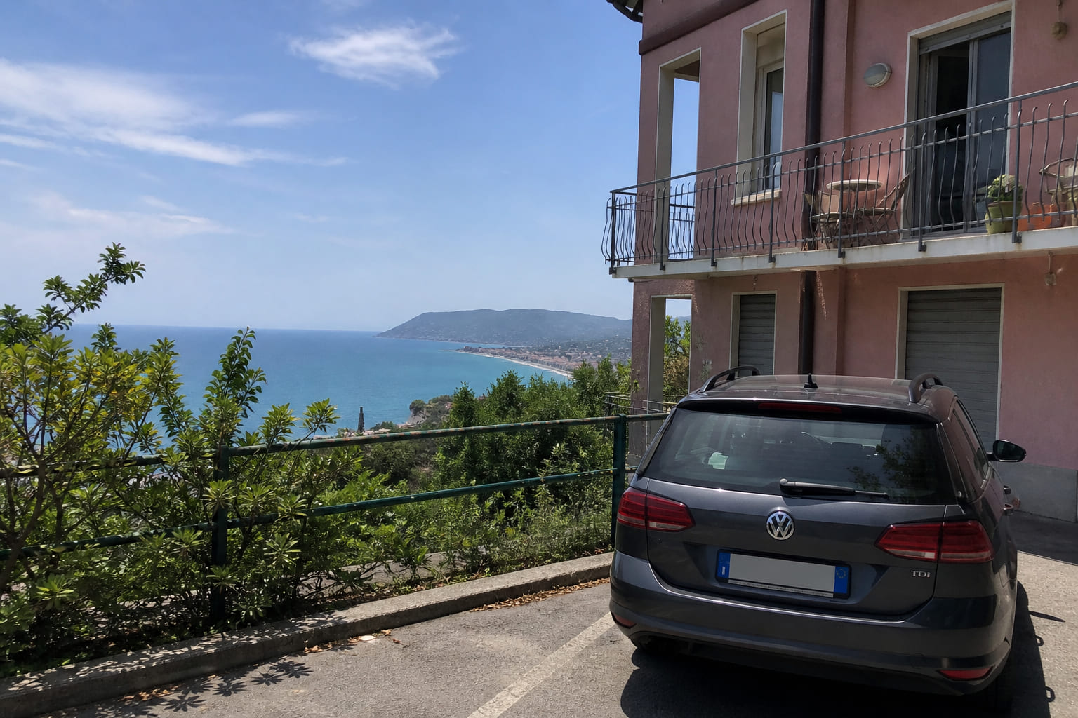 Car parked at a Ligurian coast apartment near Albenga — tourist phone photo look