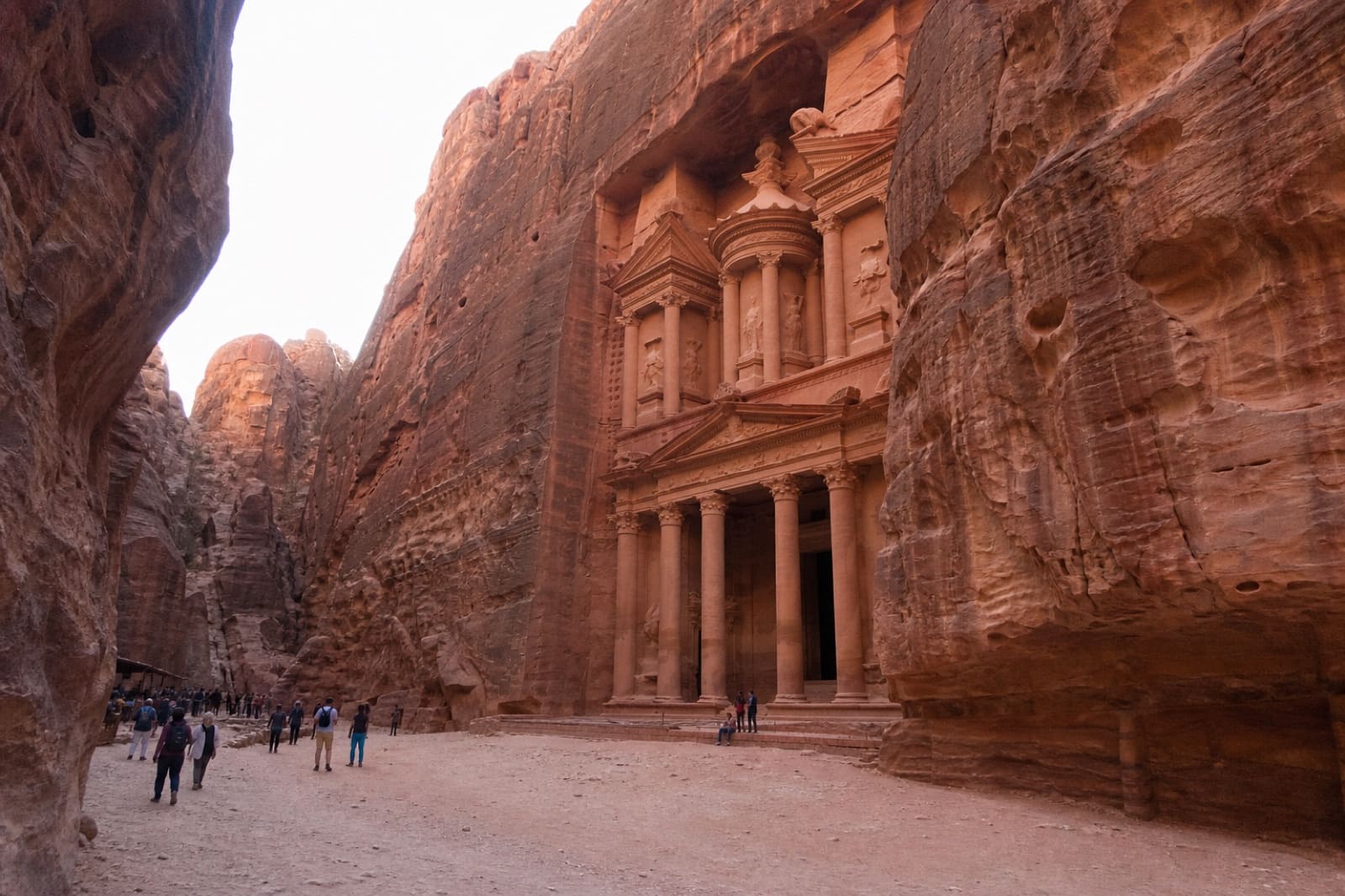 Petra Treasury carved into rose sandstone cliffs — casual tourist phone photo in Jordan