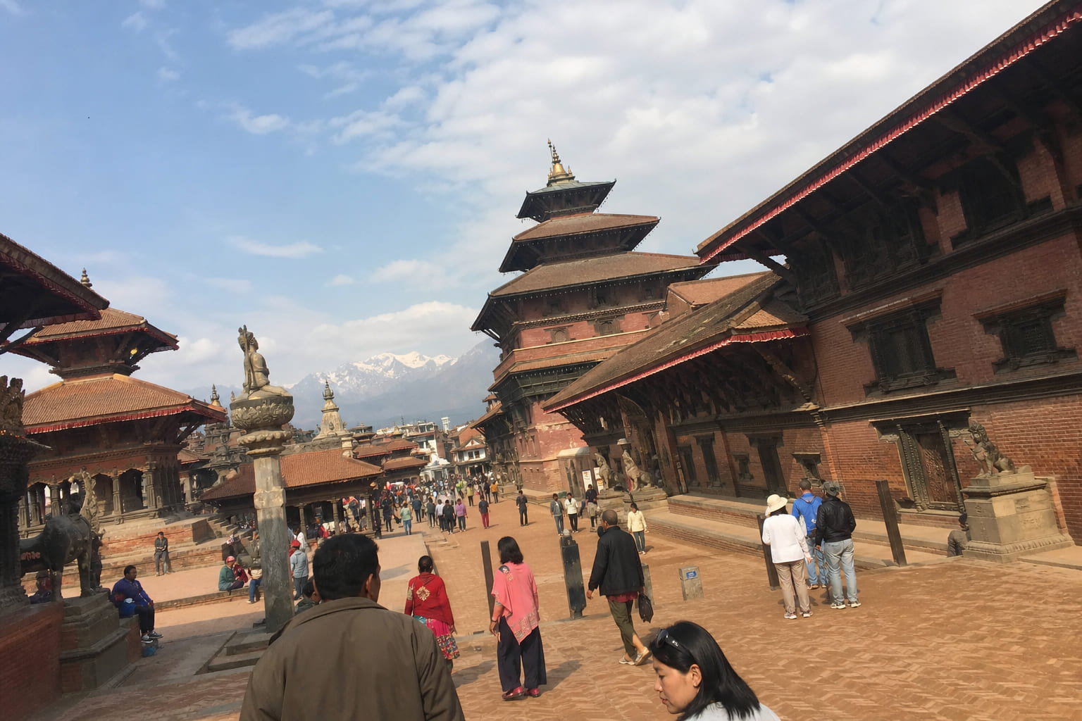 Bhaktapur Durbar Square in Nepal — ornate wooden temples and red brick, casual phone photo by a tourist