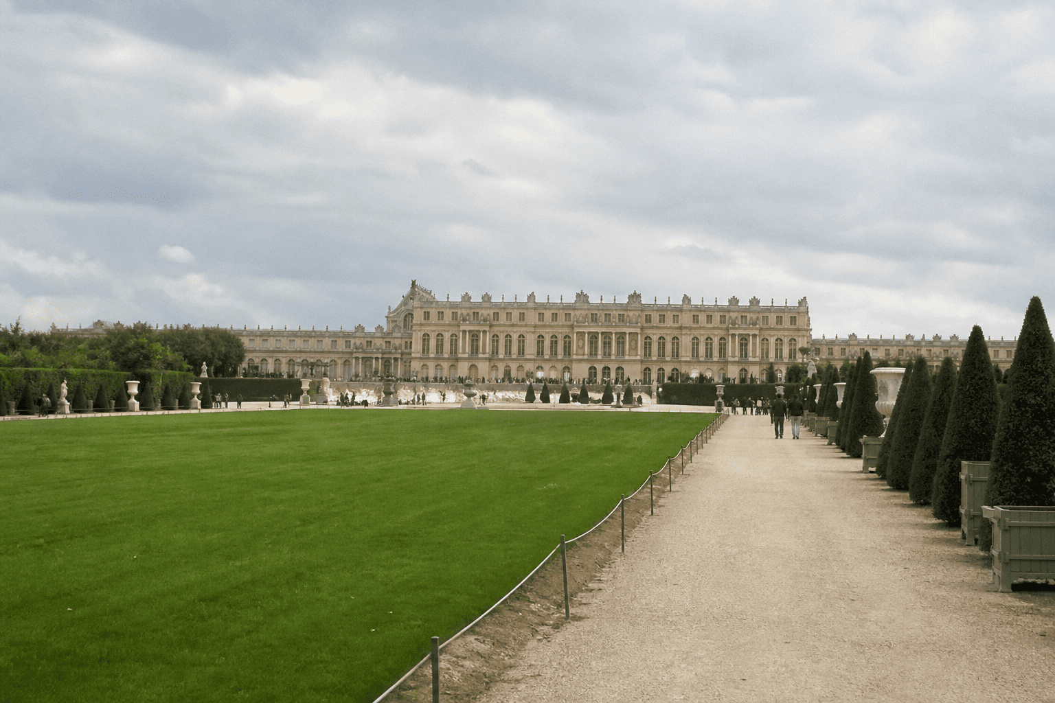Phone snapshot of Versailles garden avenues with the palace facade in the distance