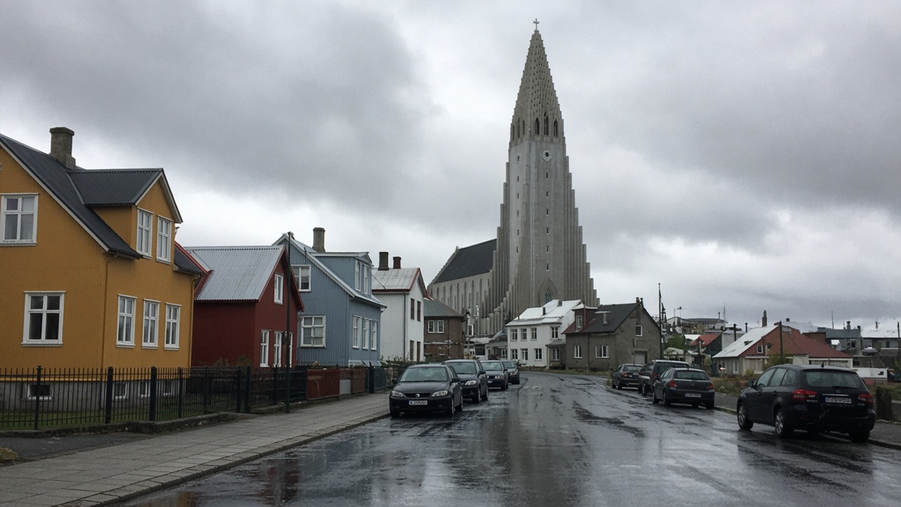 Hallgrímskirkja rising above a Reykjavik street on a grey day — tourist phone-photo style