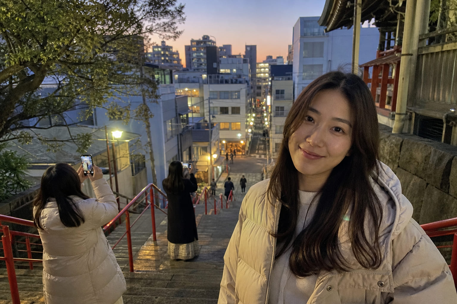Tourist phone photo of the red railings at Suga Shrine staircase in Tokyo — Your Name anime location