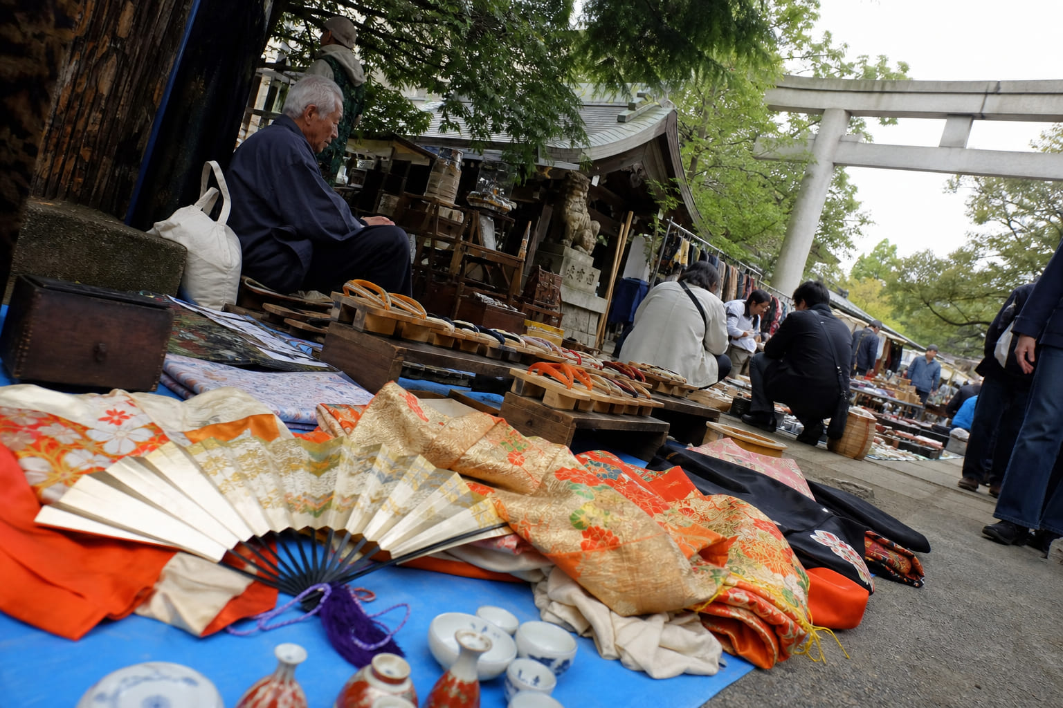Vintage kimono and antiques at a Tokyo shrine flea market — casual smartphone travel photo